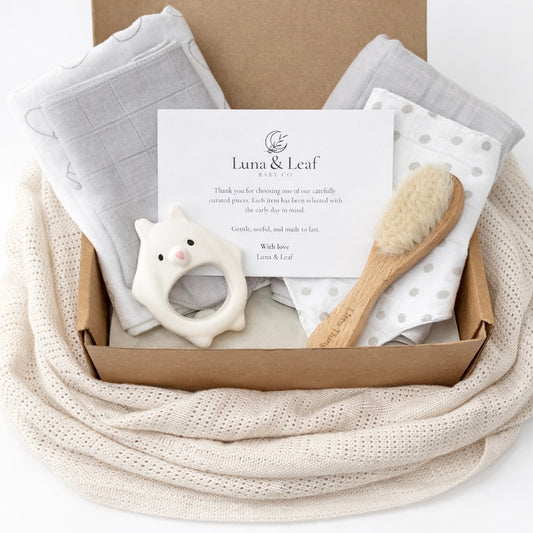 Core baby bundle with 2 muslin cloths, 2 dribble bibs, natural rubber teether and goat hair brush